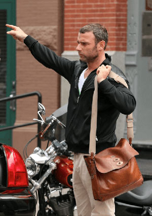 male celebrities that wear cool leather satchels